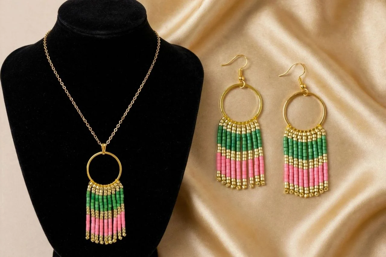 Gold-tone hoop pendant necklace with pink and green seed bead fringe and matching hook earrings